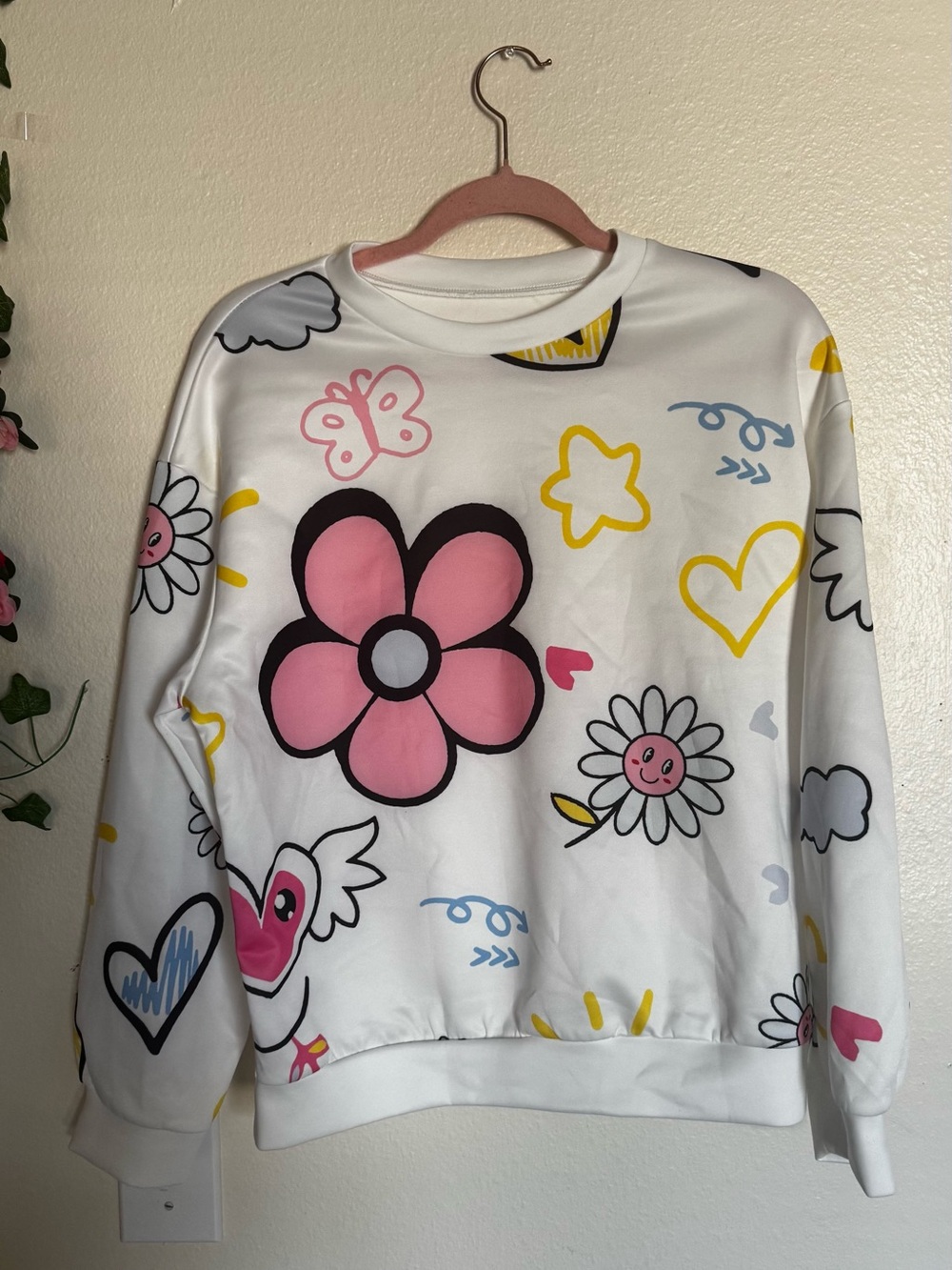 White Sweatshirt with Pink Flower Graphic